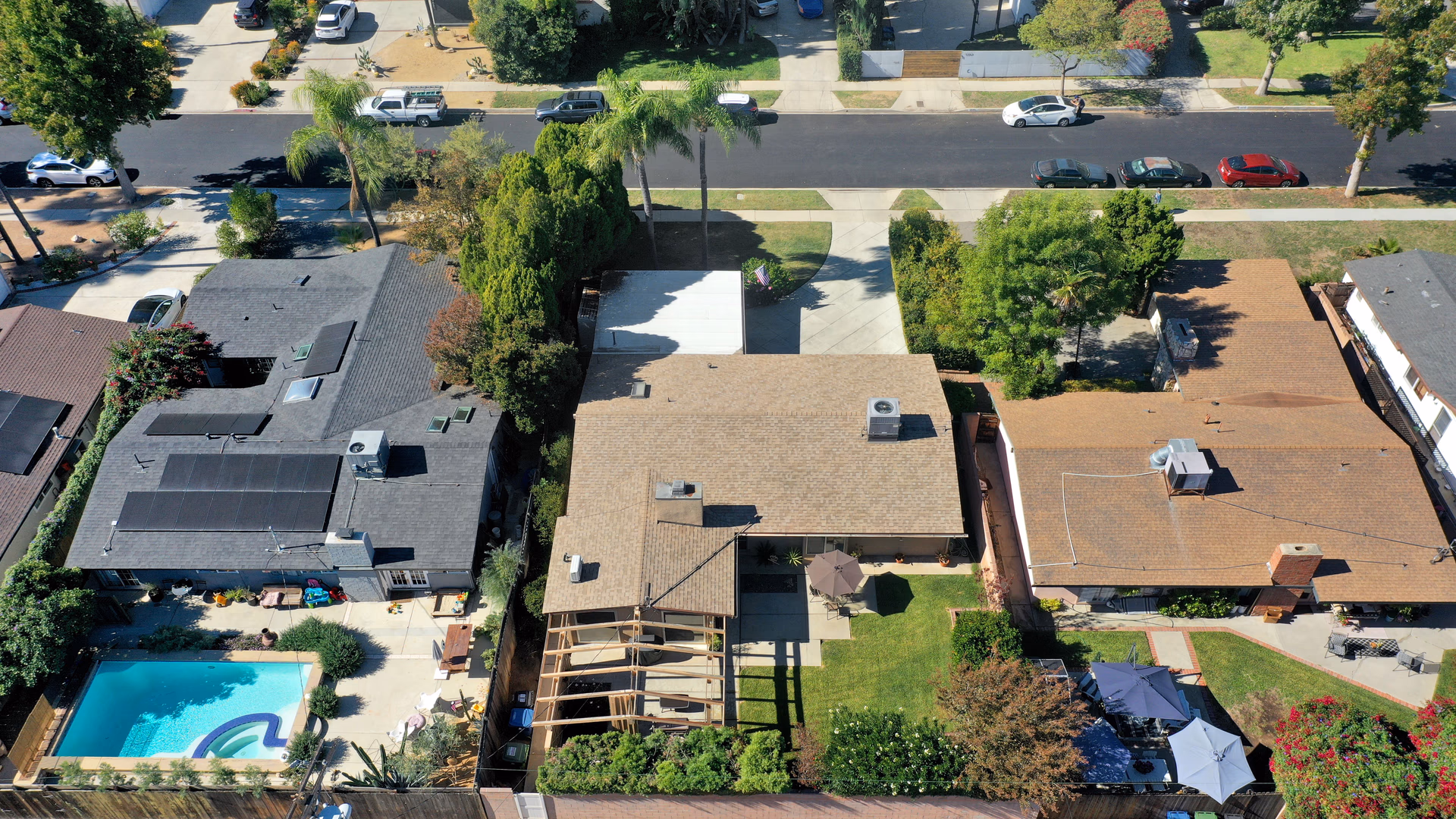 This Corbin Palms Mid Century Modern home was designed by renowned architects Dan Palmer & William Krisel. The homes open floor plan has 4 family bedrooms & 1.75 remodeled baths. The home is 1644 square feet situated on a 6900 square foot lot. The spacious sunlit living room has vaulted wood beam ceilings and is conveniently located adjacent to the dining room with lighted ceiling fan, family room with direct access to the backyard & remodeled kitchen. The family chef will love the remodeled kitchen with ample cabinets, quartz counters & backsplash, a newer range & microwave, refrigerator (included), newer dishwasher, dual basin stainless steel sink, large pantry & laundry room with washer/dryer (included). The living room has beautiful Parque wood floors & cozy floor to ceiling brick fireplace. The home’s many amenities include central AC/heat for year-round comfort, copper plumbing, newer roof, freshly painted exterior, remodeled kitchen, newer appliances, remodeled bathrooms & wood beam ceilings. You’ll enjoy entertaining family & friends in the lovely private backyard with lush mature landscaping, concrete patio & grassy play area. There’s a large concrete driveway and 2 car carport with storage. Close to orange line, World Class shopping, dining & entertainment at The Village at Warner Center & easy freeway access to the 101 freeway.