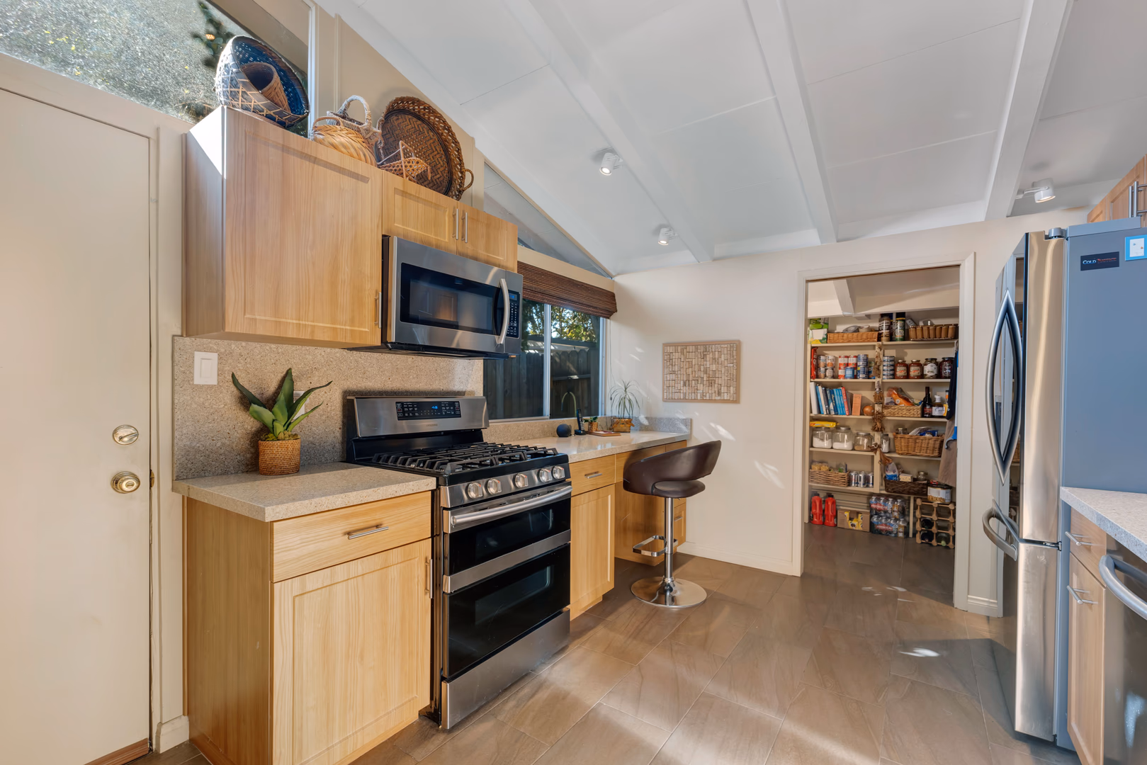 This Corbin Palms Mid Century Modern home was designed by renowned architects Dan Palmer & William Krisel. The homes open floor plan has 4 family bedrooms & 1.75 remodeled baths. The home is 1644 square feet situated on a 6900 square foot lot. The spacious sunlit living room has vaulted wood beam ceilings and is conveniently located adjacent to the dining room with lighted ceiling fan, family room with direct access to the backyard & remodeled kitchen. The family chef will love the remodeled kitchen with ample cabinets, quartz counters & backsplash, a newer range & microwave, refrigerator (included), newer dishwasher, dual basin stainless steel sink, large pantry & laundry room with washer/dryer (included). The living room has beautiful Parque wood floors & cozy floor to ceiling brick fireplace. The home’s many amenities include central AC/heat for year-round comfort, copper plumbing, newer roof, freshly painted exterior, remodeled kitchen, newer appliances, remodeled bathrooms & wood beam ceilings. You’ll enjoy entertaining family & friends in the lovely private backyard with lush mature landscaping, concrete patio & grassy play area. There’s a large concrete driveway and 2 car carport with storage. Close to orange line, World Class shopping, dining & entertainment at The Village at Warner Center & easy freeway access to the 101 freeway.