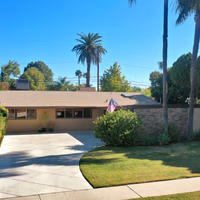 This Corbin Palms Mid Century Modern home was designed by renowned architects Dan Palmer & William Krisel. The homes open floor plan has 4 family bedrooms & 1.75 remodeled baths. The home is 1644 square feet situated on a 6900 square foot lot. The spacious sunlit living room has vaulted wood beam ceilings and is conveniently located adjacent to the dining room with lighted ceiling fan, family room with direct access to the backyard & remodeled kitchen. The family chef will love the remodeled kitchen with ample cabinets, quartz counters & backsplash, a newer range & microwave, refrigerator (included), newer dishwasher, dual basin stainless steel sink, large pantry & laundry room with washer/dryer (included). The living room has beautiful Parque wood floors & cozy floor to ceiling brick fireplace. The home’s many amenities include central AC/heat for year-round comfort, copper plumbing, newer roof, freshly painted exterior, remodeled kitchen, newer appliances, remodeled bathrooms & wood beam ceilings. You’ll enjoy entertaining family & friends in the lovely private backyard with lush mature landscaping, concrete patio & grassy play area. There’s a large concrete driveway and 2 car carport with storage. Close to orange line, World Class shopping, dining & entertainment at The Village at Warner Center & easy freeway access to the 101 freeway.