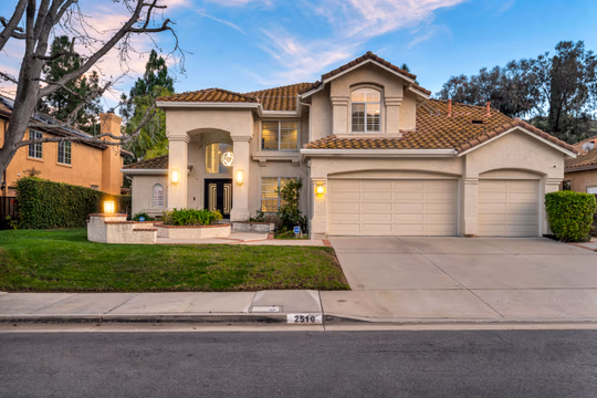Featured in Malibu Magazine Located in the highly desirable Three Springs neighborhood & top-rated schools, scenic parks, shopping, and fine dining, this home offers the perfect blend of luxury, comfort, and community. This exceptional, fully updated residence offers striking architectural presence, refined modern interiors, and a true resort-style backyard in a private, scenic setting. The grand covered entry leads to custom double doors, opening into a dramatic two-story foyer with polished marble-style flooring, a statement chandelier, and a sweeping contemporary LED lighted staircase. The main living spaces are highlighted by soaring ceilings, expansive windows, and abundant natural light. There are 5 bedrooms and 4 bathrooms with 4,258 sqft situated on a 13,783 sqft lot. The formal living room features a sleek wall-mounted linear fireplace and overlooks the backyard, creating an elegant yet inviting atmosphere. Open sight lines connect the formal areas to the heart of the home, enhancing both flow and functionality. There is also a fabulous theater. The beautifully remodeled chef’s kitchen is designed for both entertaining and everyday living, featuring custom cabinetry, quartz countertops, a large center island with gas cook-top, stainless steel appliances, double ovens, built-in stainless-steel refrigerator, stainless steel sink, recessed lighting, large pantry, designer tile backsplash, and ample storage. The kitchen opens seamlessly to the spacious family/media room and casual dining area, offering clear views of the backyard and effortless indoor-outdoor living. The family room provides a comfortable gathering space with recessed lighting, built-in storage, and a modern fireplace feature, while the adjacent breakfast nook is surrounded by windows, filling the space with natural light and views of the outdoor entertaining areas. Multiple flexible rooms offer versatility for home offices, fitness spaces, or guest accommodations, ideal for today’s work-from-home lifestyle. The primary suite is a private retreat with generous proportions, a custom walk-in closet with extensive built-ins, and a spa-inspired bathroom. The primary bath includes a large glass-enclosed walk-in shower with stone tile surround, pebble flooring, rainfall shower head, built-in bench seating, dual vanities with modern cabinetry, and integrated lighting. Secondary bedrooms are spacious and well-appointed, while updated secondary bathrooms feature contemporary vanities, modern fixtures, and clean, timeless finishes. The backyard is a private resort-style oasis designed for year-round enjoyment. Highlights include a custom infinity pool and raised spa with waterfall features and ambient lighting, expansive patio and entertaining areas, a built-in outdoor kitchen/BBQ with bar seating, fire feature, and elevated deck spaces surrounded by mature landscaping. Scenic hillside views and privacy create a serene environment ideal for relaxation and family entertainment. Additional features include a three-car-attached garage with direct house access, a laundry room with sink, central AC/Heat for year-round comfort with dual zone system with separate upstairs and downstairs units, tank-less water heater, 16.5 KW of solar panels for energy efficiency, motorized blinds and a well-maintained exterior with classic architectural details. Located in an established neighborhood near open space and trails, this turnkey home offers an exceptional blend of style, comfort, and indoor-outdoor living. With access to the award-winning Las Virgenes Unified School. District and the natural beauty of Westlake Village, this is a rare opportunity to own an extraordinary home in an unbeatable setting. Call/text Steven Green at Park Regency 818-388-3045 or stevengreen4re@aol.com to arrange your private tour.